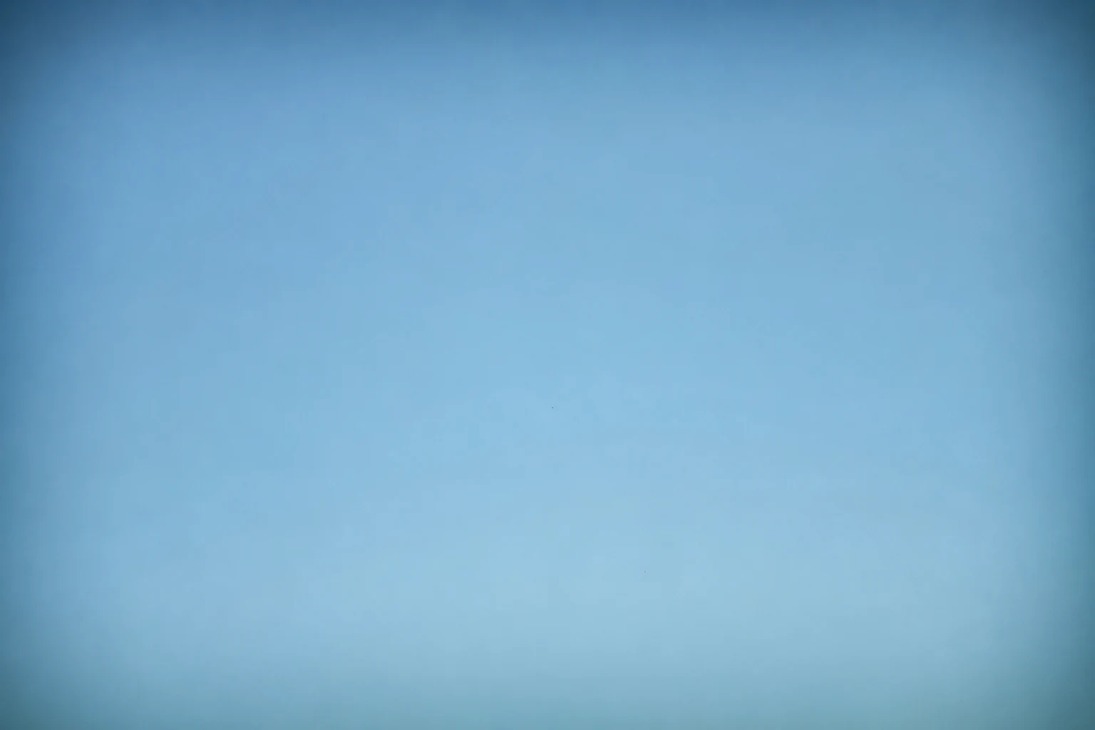 Test shot of the same blue sky, even and free of dust spots, after sensor cleaning